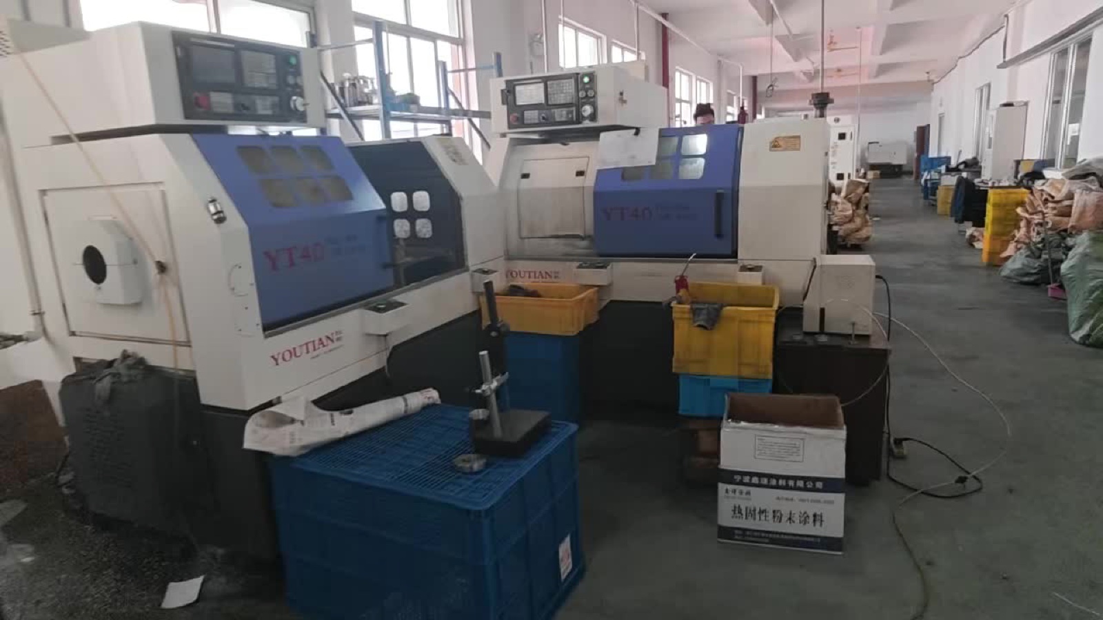 Row of CNC lathes machining motor housings at Shenghe Motor factory